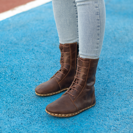 Barefoot Grounding Effect Crazy Classic Brown Leather Boots for Women displayed on a blue surface.