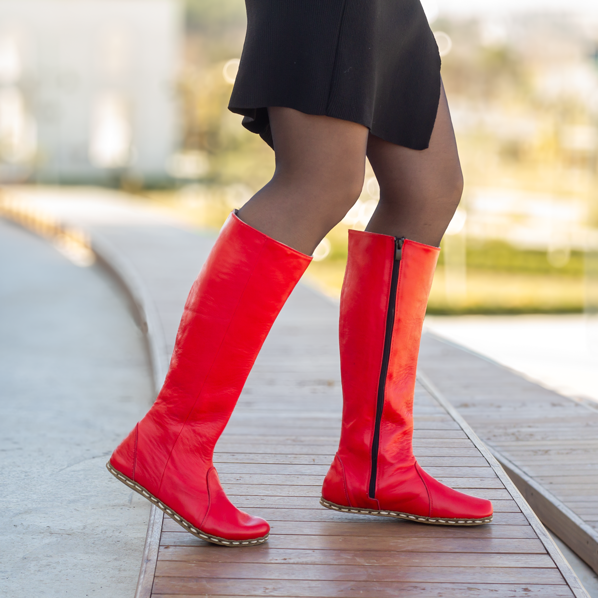 Flat red knee high boots hotsell